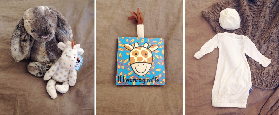 ^^the softest bunny in the world. An adorable giraffe rattle. A book with a tail and soft things to touch ;) and oh the softest little outfit you ever did feel. I die over that little hat ^^